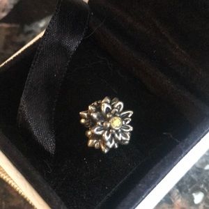 Pandora edelweiss retired charm. Gently used with three yellow cubic zirconia.